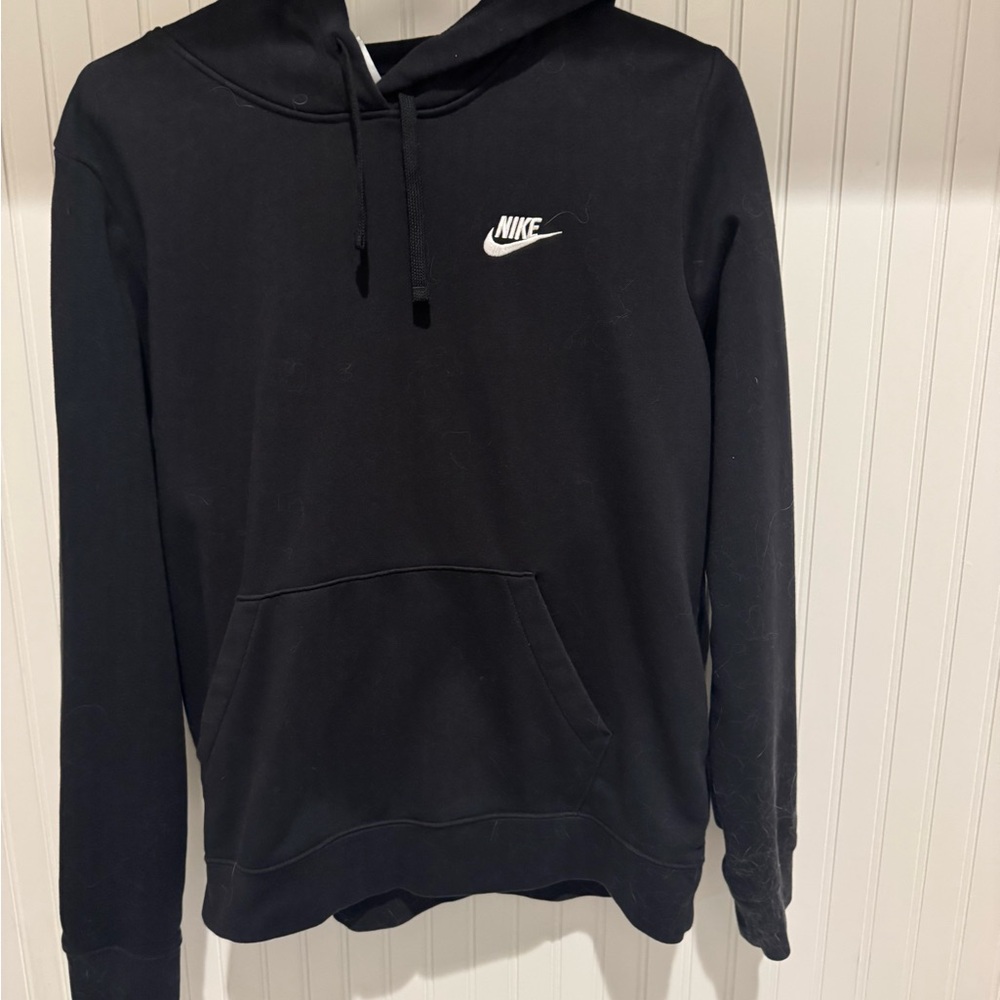 Woman’s Nike black hoodie.